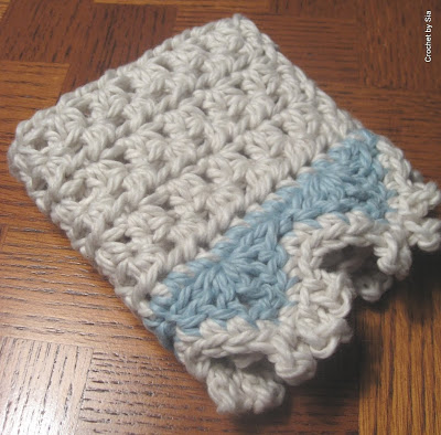 Folded Crochet potholder sitting on a table