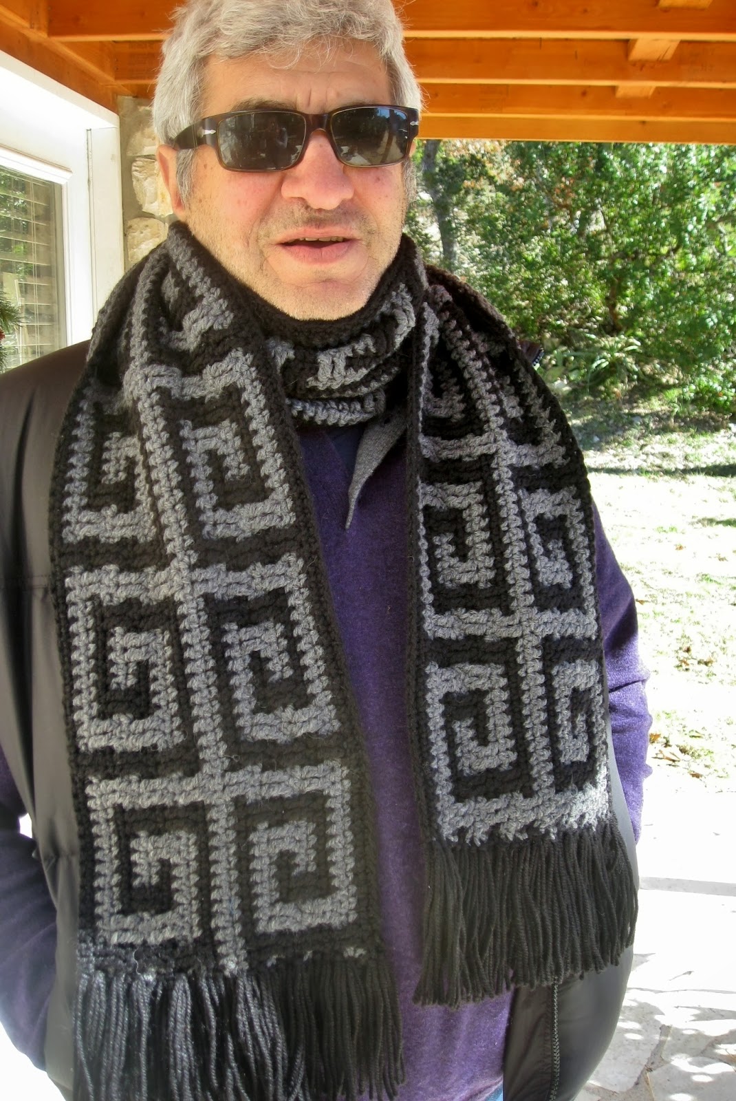 Man wearing the Andras crocheted scarf