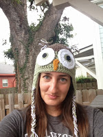 Front view of a very large owl crocheted hat