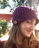 Side view of purple crocheted hat