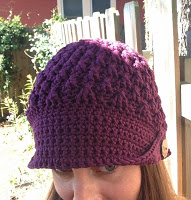 Front/top view of purple crocheted hat