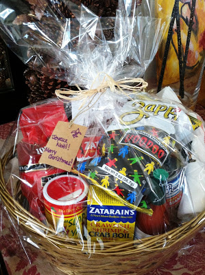 "Gift basket full of New Orleans products wrapped in cellophane"